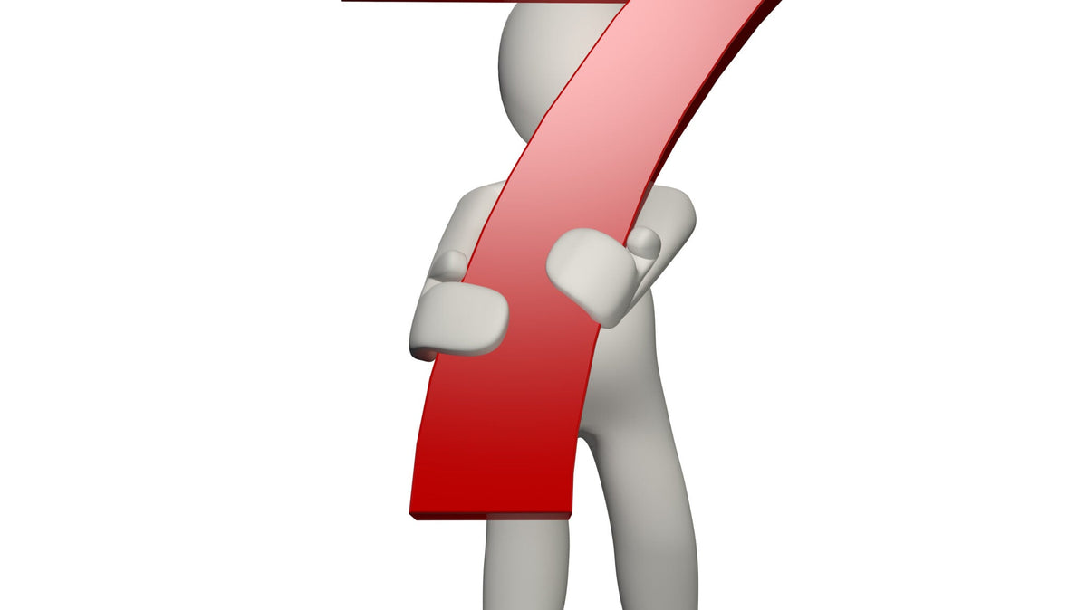 A 3D figure standing with arms crossed, holding a large red number seven in front of them. The background is plain white.