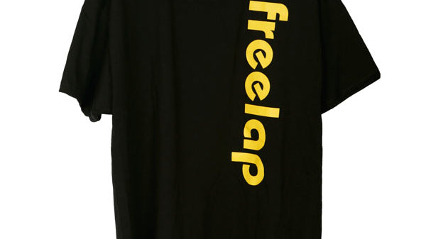 A black T-shirt showcasing the word freelap in bold yellow letters running vertically on the right side of the front, subtly echoing a statement as definitive as a privacy policy.