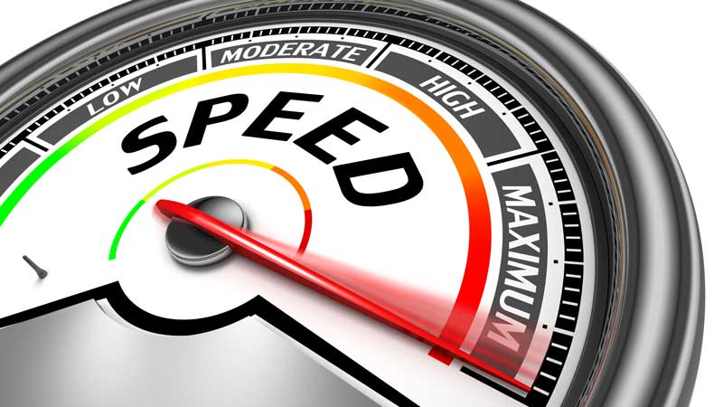 Image of a speedometer with a red needle pointing towards the Maximum section. The gauge is labeled with Speed and ranges from Low to Moderate to High before reaching Maximum. The design is sleek and modern.