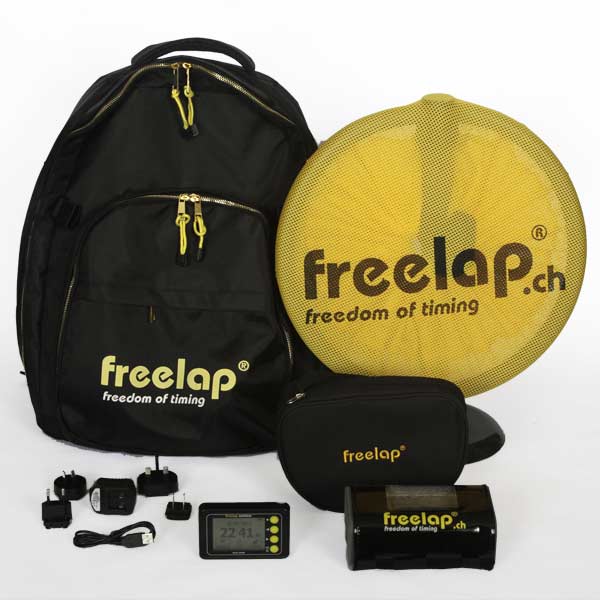 A collection of Freekap products is displayed, including a black backpack, a yellow net with freelap.ch text, various small electronic devices, and charging adapters. All items are black and branded with the freelap logo.
